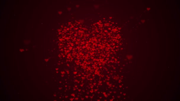 Czerwone serce jest izolowane na tle Burgundii. Nagromadzenie małych serc tworzy jedno duże serce. Przejście od dołu do góry. Całe serce jest powiększane. Z bliska. Kopiuj przestrzeń. — Wideo stockowe