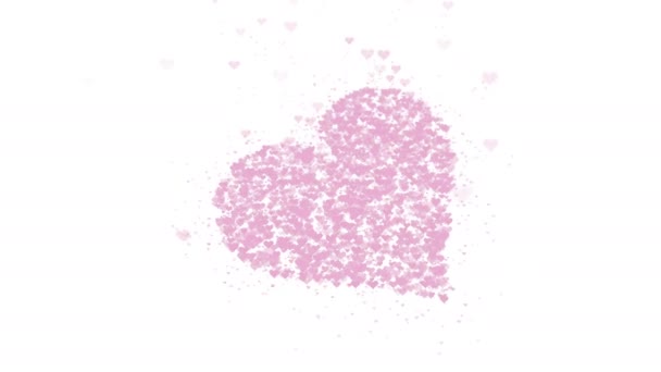 Cuore rosa sfocato è isolato su sfondo bianco. L'accumulo di piccoli cuori crea un unico grande cuore. Chiudete. Copia spazio . — Video Stock