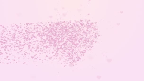 Cuore rosa sfocato è isolato su sfondo rosa chiaro. L'accumulo di piccoli cuori crea un unico grande cuore. Cuoricini che appaiono dal lato sinistro. Chiudete. Copia spazio . — Video Stock