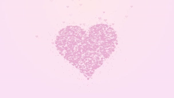 Rozmazané růžové srdce je izolované na světle růžovém pozadí. Nahromadění malých srdcí vytváří jedno velké srdce. Zavři to. Kopírovat místo. — Stock video