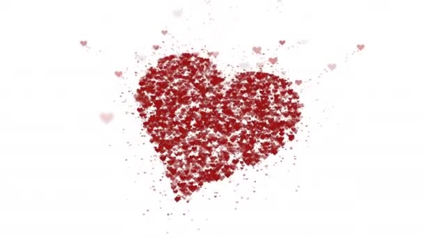El corazón rojo está aislado sobre fondo blanco. La acumulación de pequeños corazones crea un gran corazón. Se está ampliando todo el corazón. De cerca. Copiar espacio . — Vídeo de stock