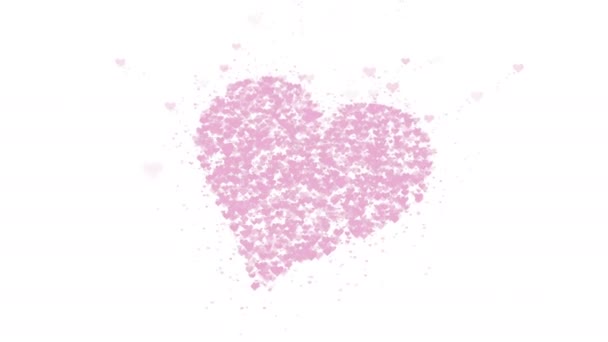 El corazón rosa borroso está aislado sobre fondo blanco. La acumulación de pequeños corazones crea un gran corazón. De cerca. Copiar espacio . — Vídeo de stock