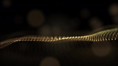 Siyah bir bokeh arka planda parlayan altın bir parçacık..