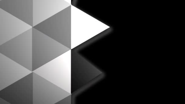 Oberfläche von Dreiecken in verschiedenen Grautönen, die sich eins nach dem anderen drehen. — Stockvideo