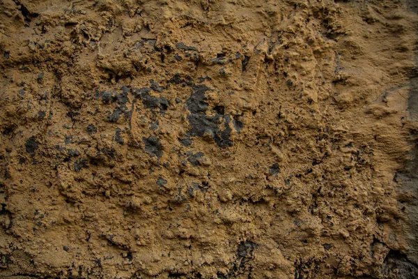 Tekstur Latar Belakang Dinding Batu Dalam Stuko Dan Cat Kuning — Stok Foto