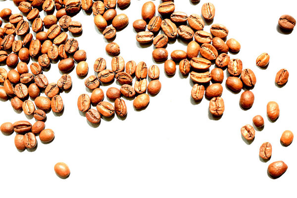 A lot of coffee beans in bulk on a white background