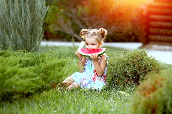 Little Girl Sitting Nature Eats Watermelon Sundress Floral Print Holding — Stock Photo, Image