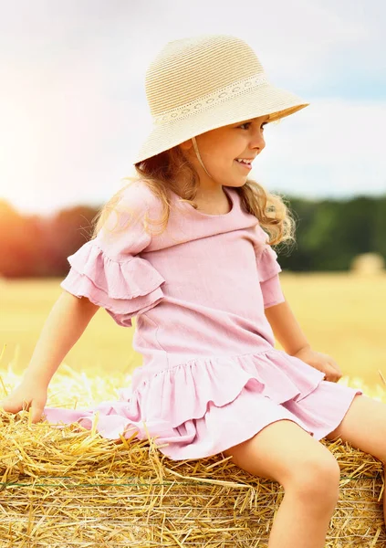 Little Caucasian Cute Girl Smiles Wicker Hat Pink Blue Dress — Stock Photo, Image