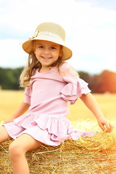 Little Caucasian Cute Girl Smiles Wicker Hat Pink Blue Dress — Stock Photo, Image