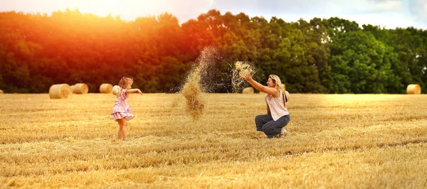 Banner Mom Daughter Caucasians Together Mown Wheat Field Throw Hay — Stock Photo, Image