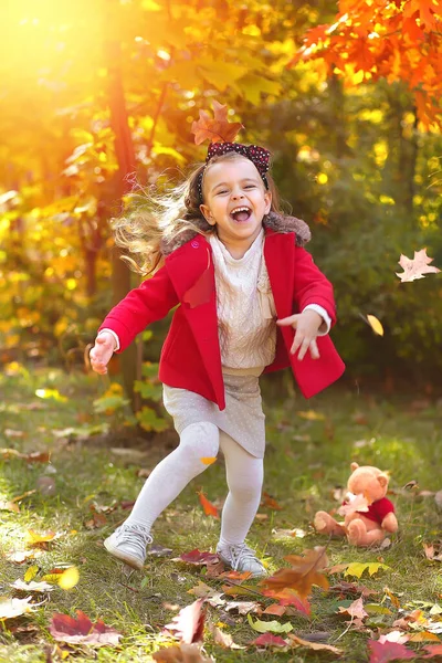 Happy Little Girl Runs Park Autumn Leaves Bright Red Coat — Stock Photo, Image