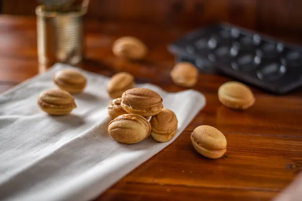 Cookies in the form of a nut with boiled condensed milk — Stock Photo, Image