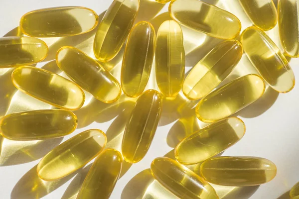 capsules of fish fat oil vitamin for heart, omega 3, macro