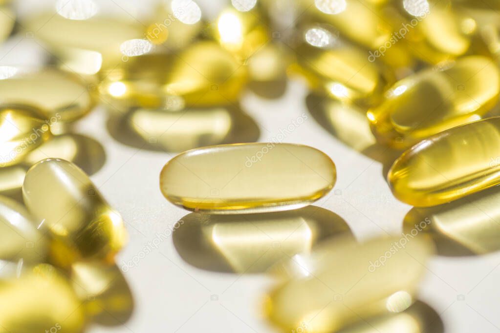 capsules of fish fat oil vitamin for heart, omega 3, macro