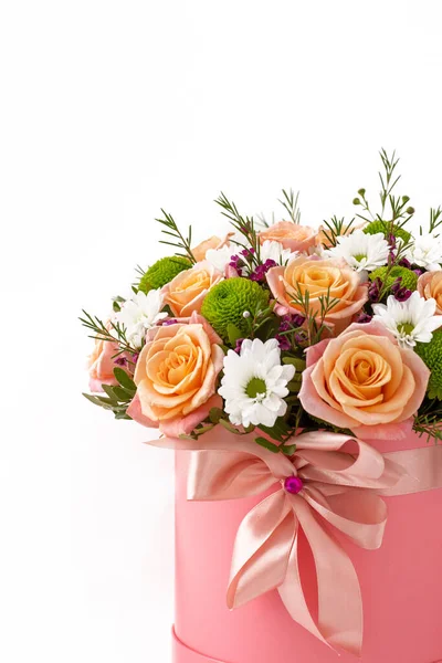 Beautiful bouquet in a coral luxury present box with a pink bow, isolated on white background — Stock Photo, Image