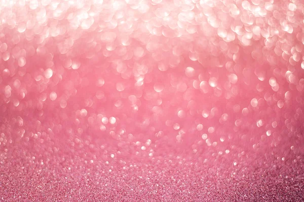 beautiful pink sequins on the glitter sparkle of sun light background with blur bright bokeh