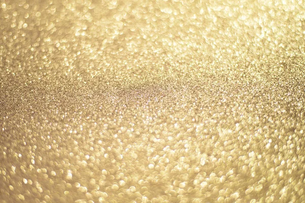 Mousserande guld bokeh bakgrund, guld färg. Guld paljetter bakgrund. — Stockfoto