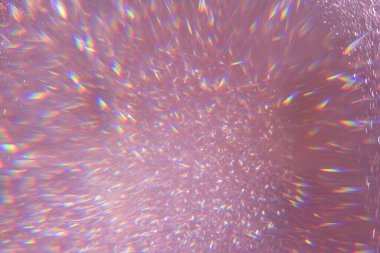 Odaklanmamış pembe pullar, parıltılar parlak halıyı ön plana çıkarıyor. Yakın çekim, çok sığ alan derinliği. Makro.