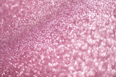 Pembe parlak bir arka planda ışıldıyor. Pembe pullar arka plan bulanıklığı
