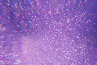 Mor renkte ışıl ışıl bir arka plan. mor pullar arka planda parlıyor.