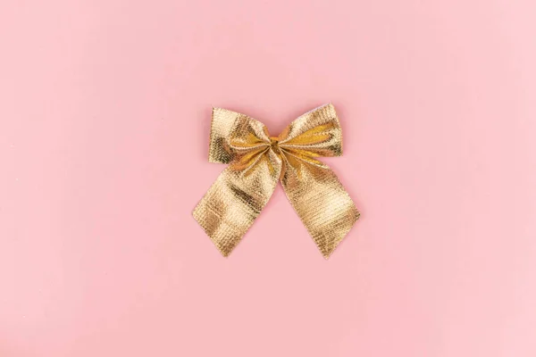 Golden Christmas Small Bow Pink Background New Year Decor Gift — Stock Photo, Image