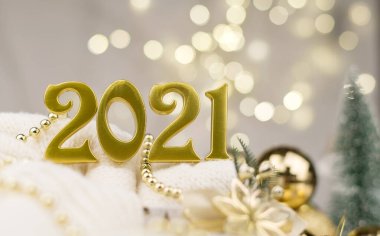 Altın Bokeh geçmişi üzerine 2021 numara. Yeni yıl havası, Noel, tebrik kartı, yeni yıl geçmişi..