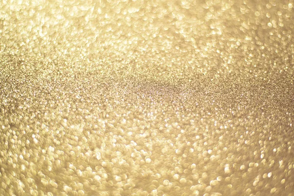 Sfondo bokeh oro scintillante, colore oro. Oro paillettes sfondo. — Foto Stock