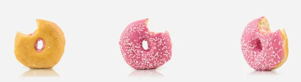 Bunch Bitten Delicious Pink Colored Donut White Background White Chocolate — стоковое фото