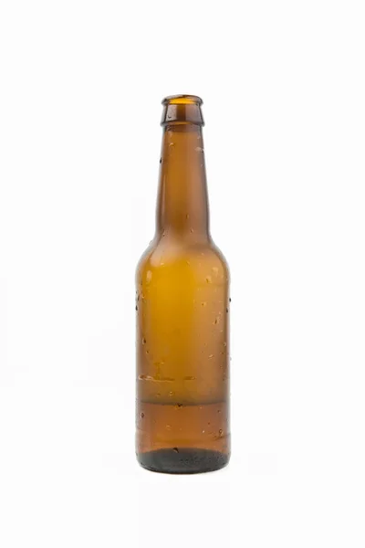 Ice Cold Wet Condensated Lager Beer Bottle With Beer And Foam Inside Isolated