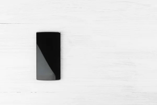 Černý Chytrý Telefon Bílém Pozadí Dřeva Prázdný Prostor Pro Vrcholový — Stock fotografie