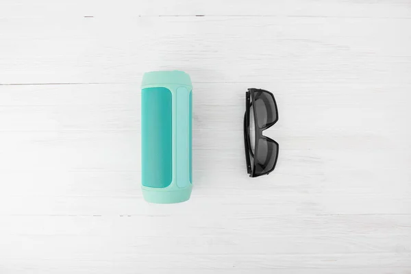 Wireless Portable Speaker Black Sunglasses Summer Vacation Concept White Wood — Stock Photo, Image