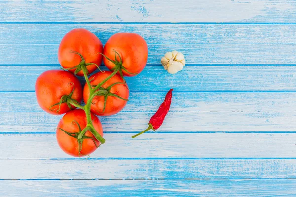 Fresh Garden Organic Bio Tomatoes With Red Peppr And Garlic On Wooden Blue And White Painted Background High Contrast Top View