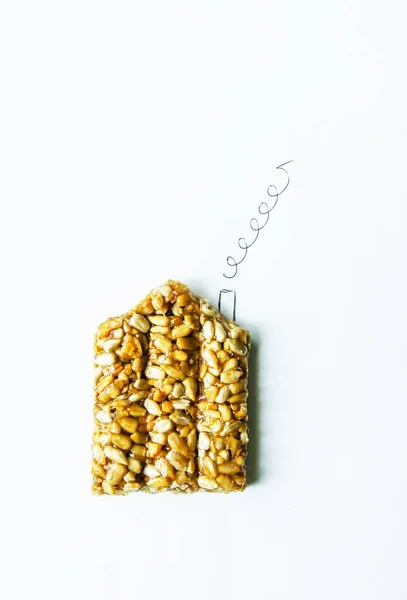 Sweets kozinaki from sunflower seeds in a shape of house — 스톡 사진