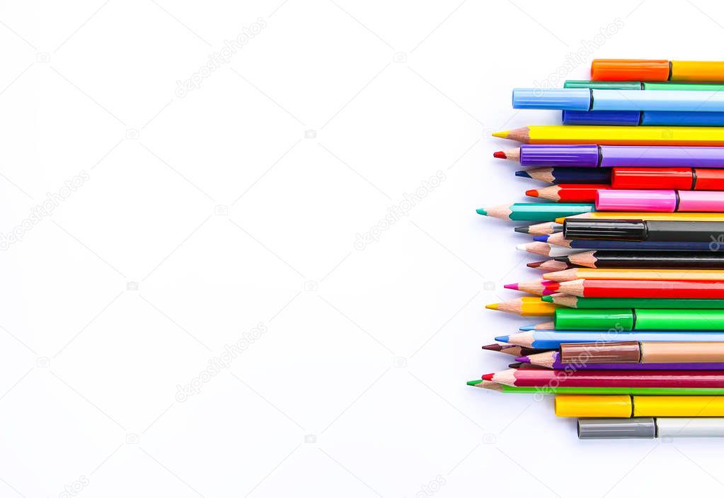 School supplies. Back to School design elements. Colored pencils on white background.