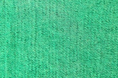 Yeşil örülmüş yün doku. Örgü numunesi..