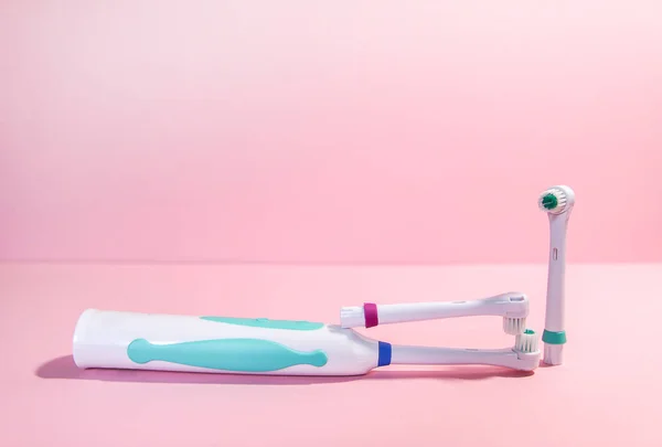 Two Electrical Toothbrushes Soft Light Pink Background — 스톡 사진