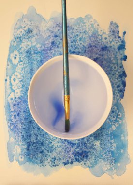 Watercolor painting with supplies