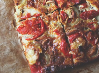 Rustic pizza with salami, tomatoes and cheese