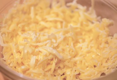 Shredded cheese close up. Ingredient for cooking.