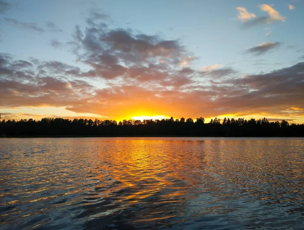 Lake surface at evening in Latvia, East Europe. Landscape with water and forest. — Stock Photo, Image