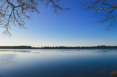 Urban landscape with bridge, modern buildings and blue sky in october.