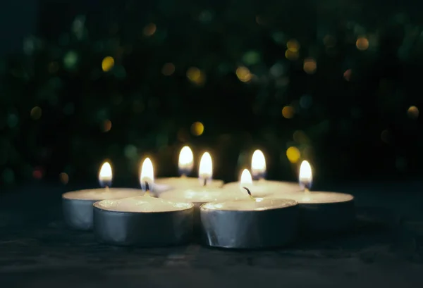 Burning candles on Christmas decoration background. — ストック写真