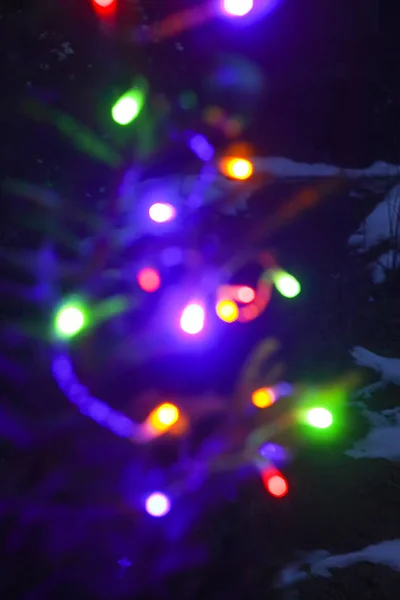 Fondo de Año Nuevo festivo con luces coloridas borrosas . — Foto de Stock