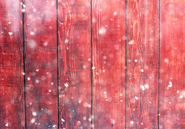 Placas de madeira e luzes bokeh brilho com neve . — Fotografia de Stock