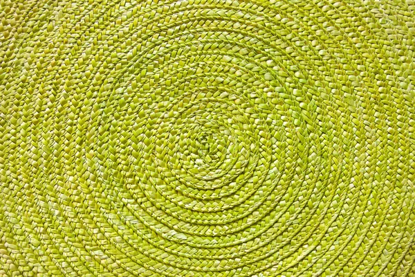 Green place mat wicker texture background.