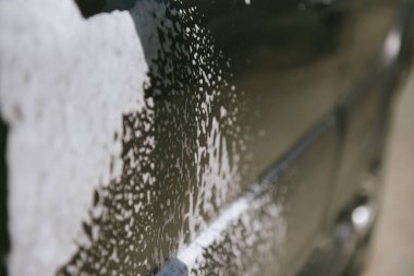 Car in the foam. Car wash. Car in the foam from cleaning agent