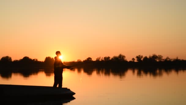 Fisherman Silhouette Spinning Fishing Reel Biting Background Evening Sunset Evening — Stockvideo