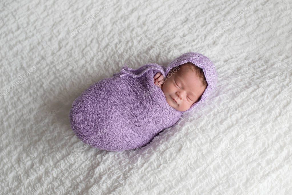 Smiling Two Week Old Newborn Baby Girl Swaddled Lavender Wrap — Stock Photo © katrinaelena