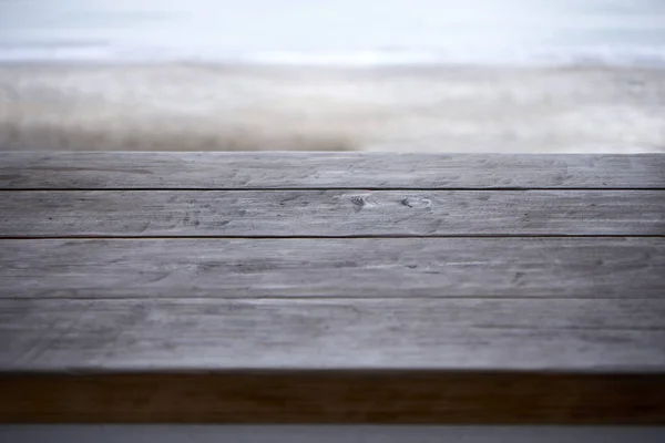 Wooden table on the background of the waterfront — 스톡 사진