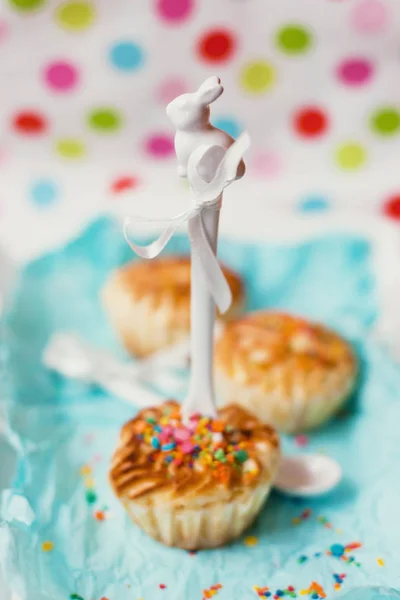 Tasty muffins with colorful sprinkles — Stock Photo, Image